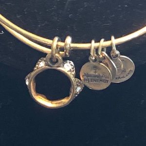 Stack of Alex and Ani rose gold bracelets